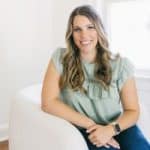 smiling woman sitting on a chair