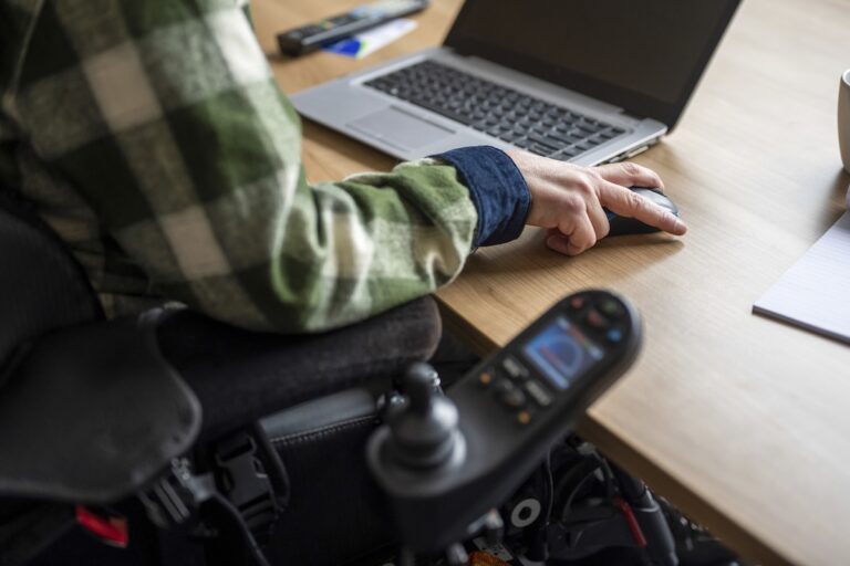 Disabled businessman working on his computer.